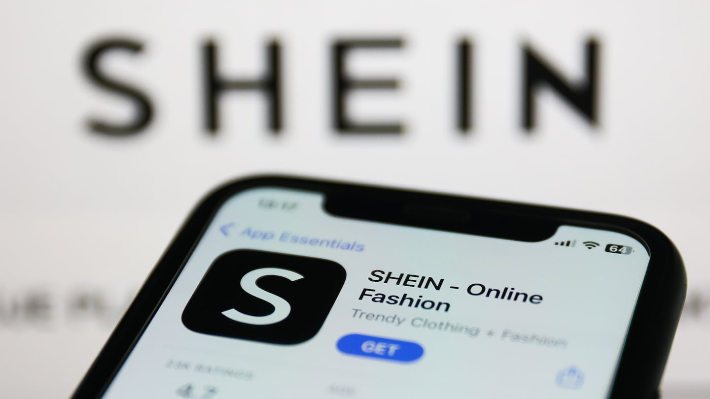 A phone displaying the download page of a Shein app