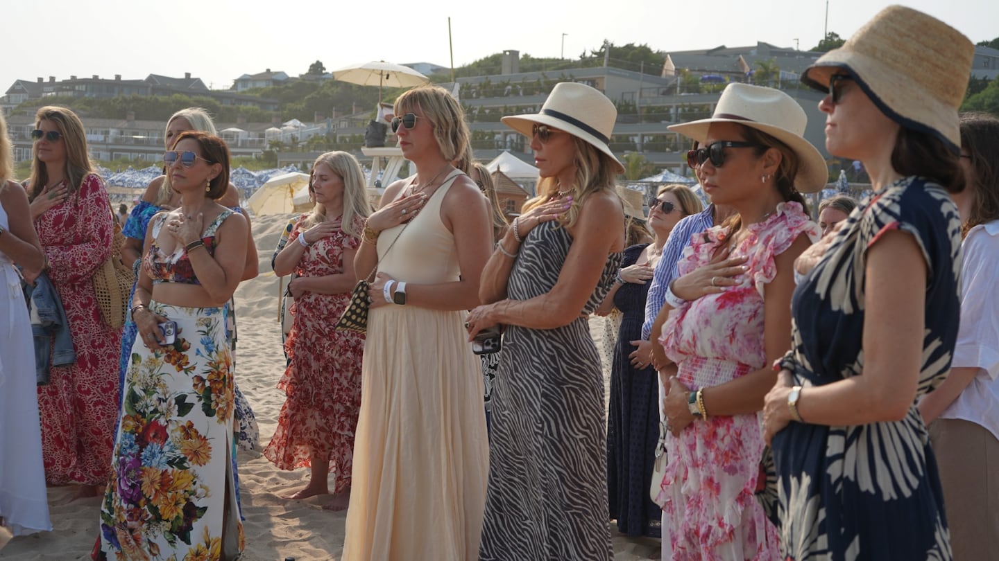 The "Dealmakehers" participate in a group meditation in The Hamptons.